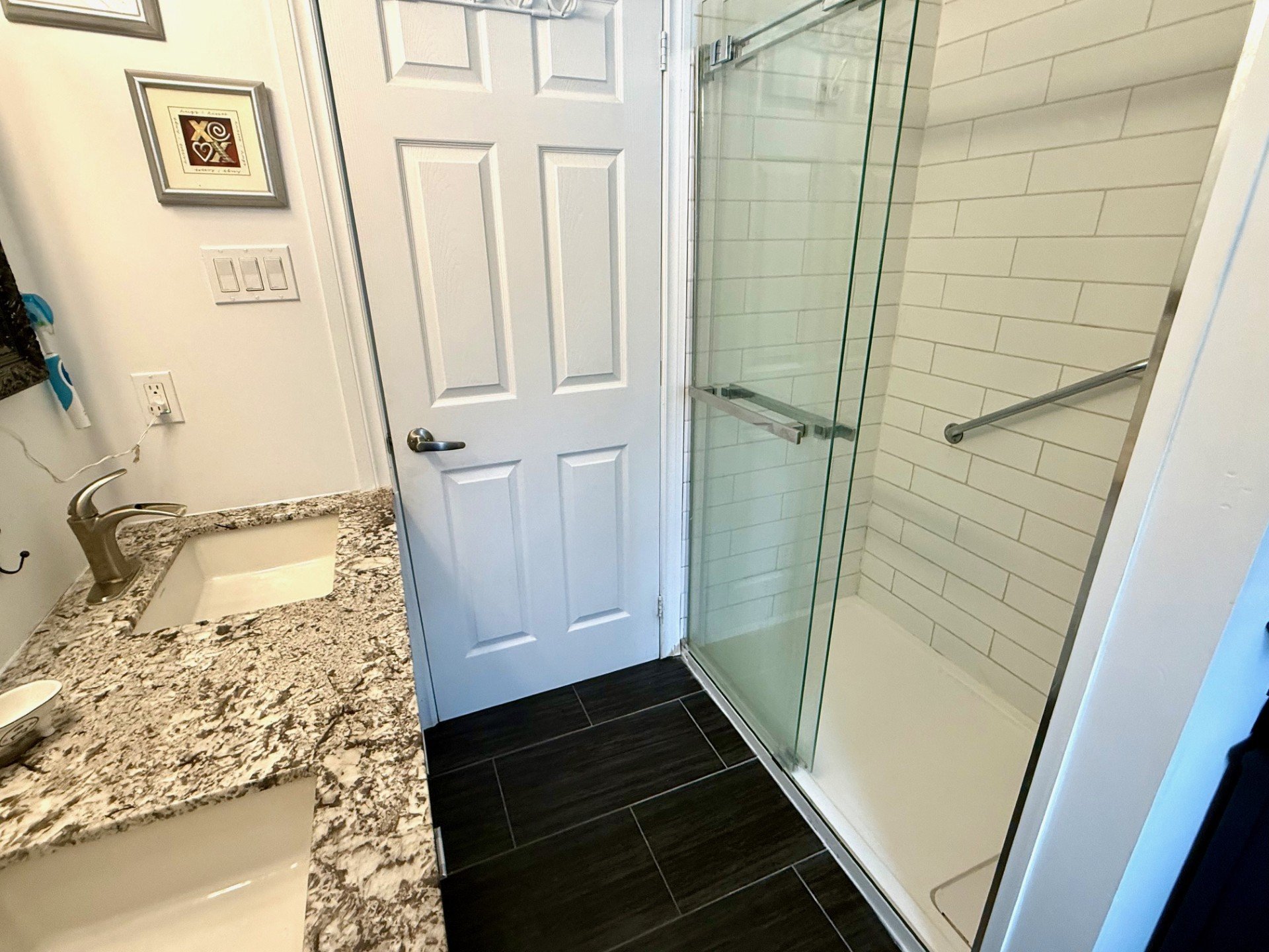 2 sinks and large glass and ceramic shower