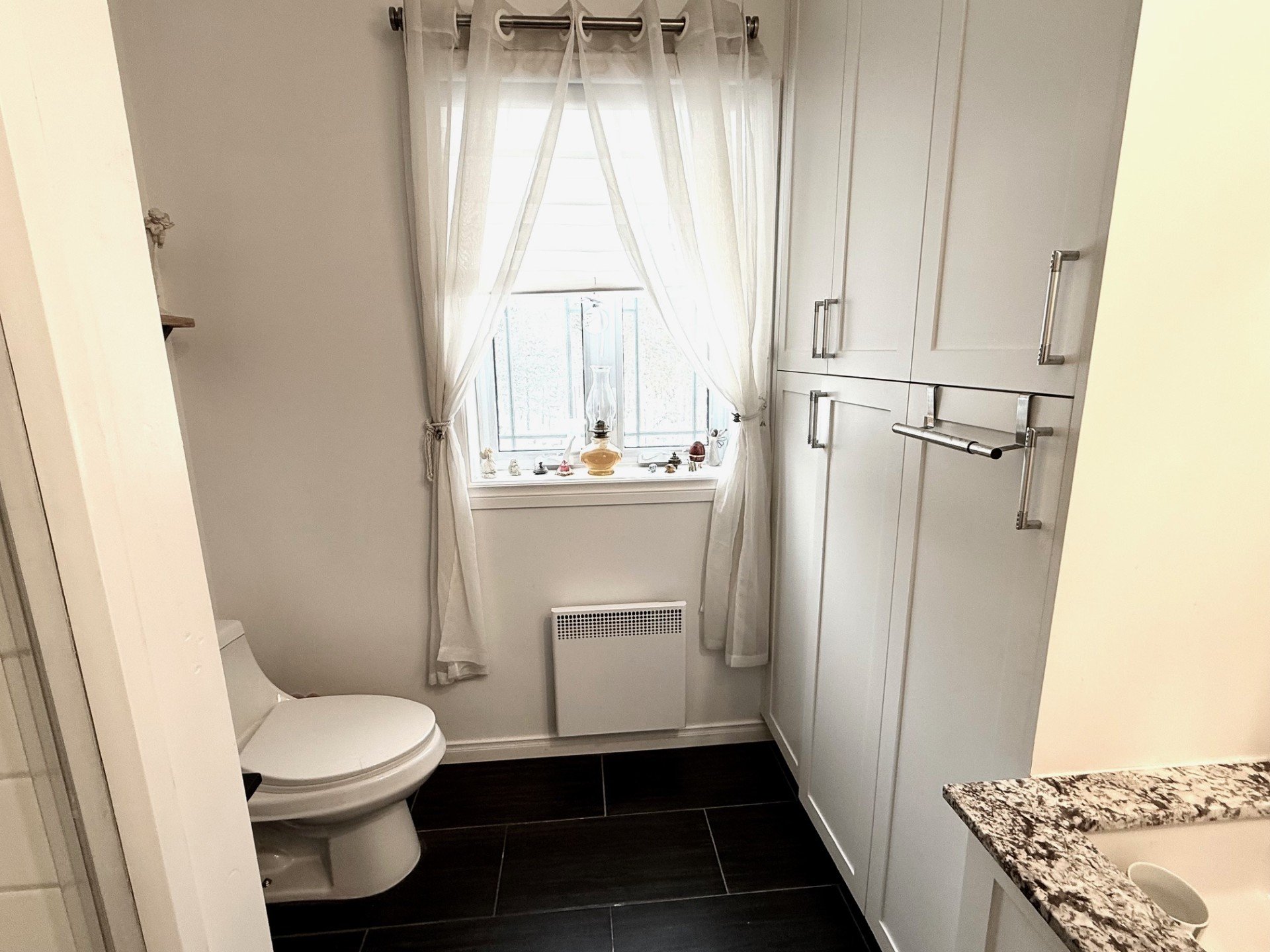 Ensuite bathroom - Lots of storage cabinets
