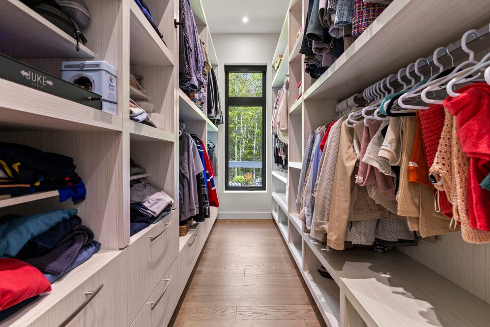 - Custom wood shelving system included in walk-in.