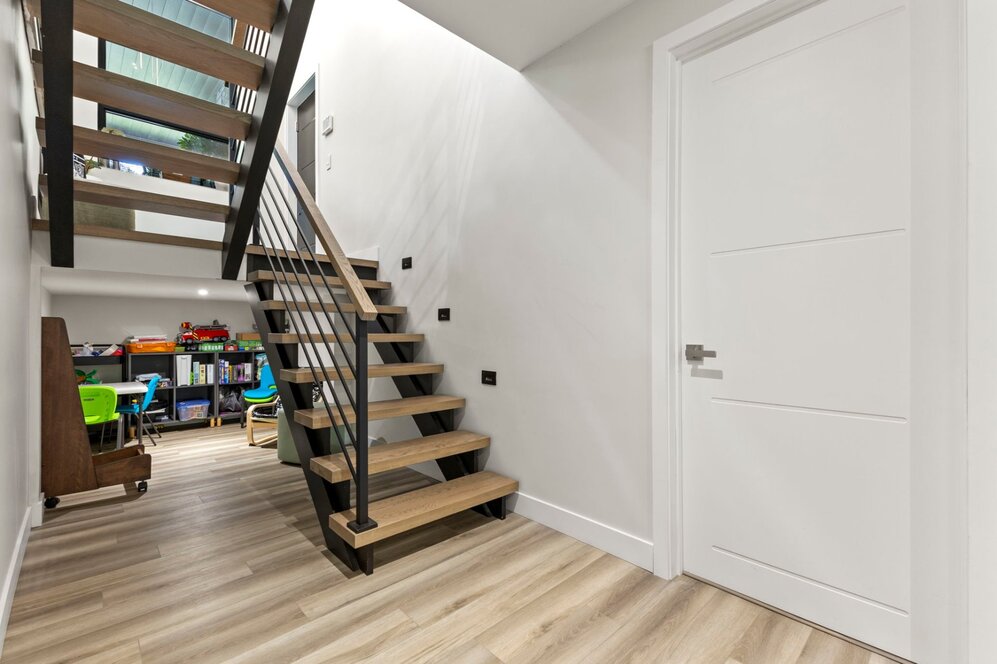 Staircase - Kids'nook under the basement stair landing.